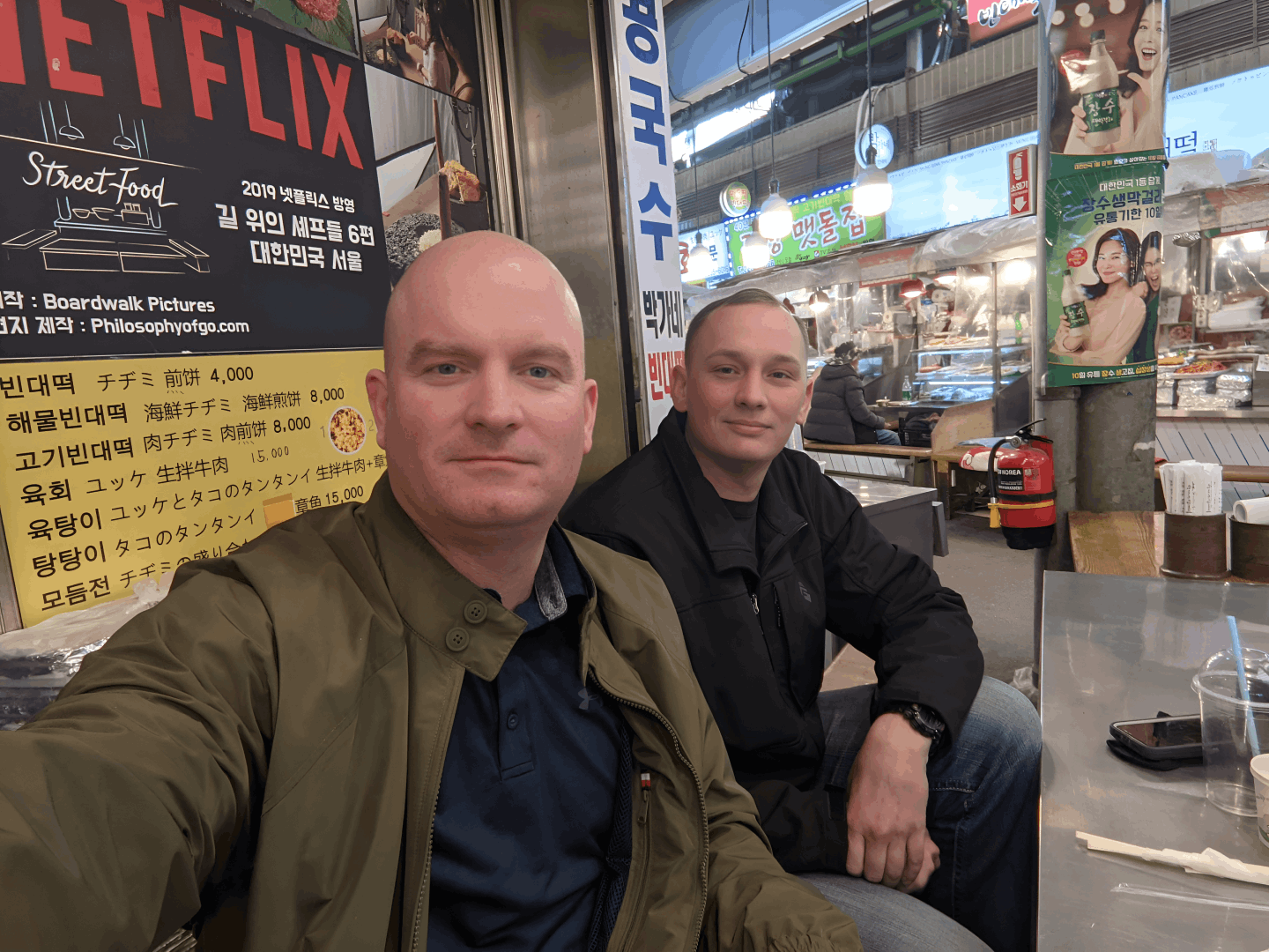 McGill and Christianson eating mung bean pancakes where Street Food Asia was filmed