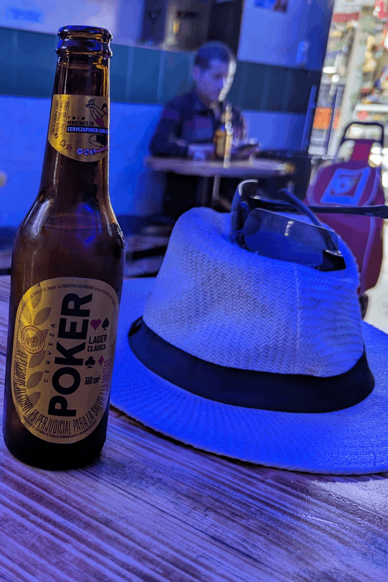 Michael McGill rests his hat and his beer inside a random bodega in Bogota, Colombia.