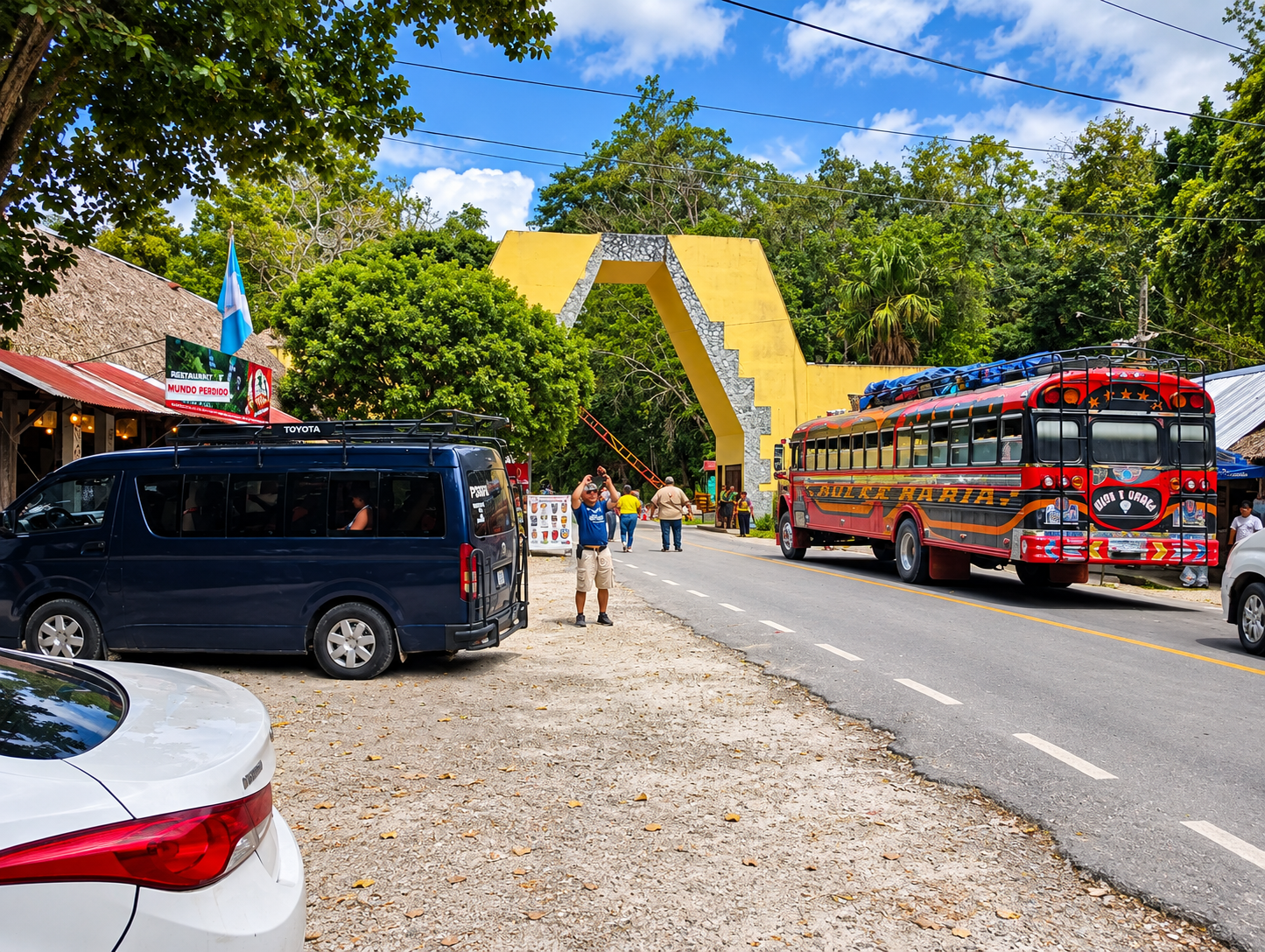 Colorful bus passing the Tikal National Park entrance during our Tikal travel journey